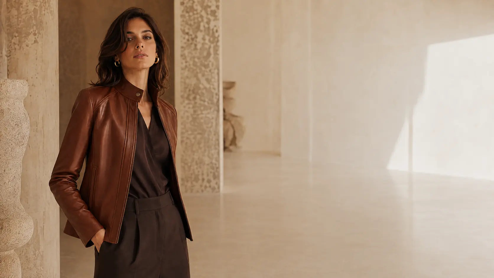Female model wearing a cognac Wolfoco leather jacket